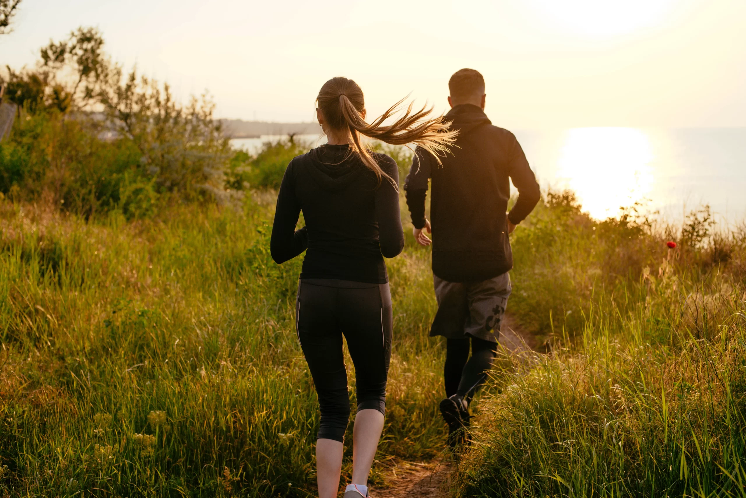 Couple stretching together outdoors